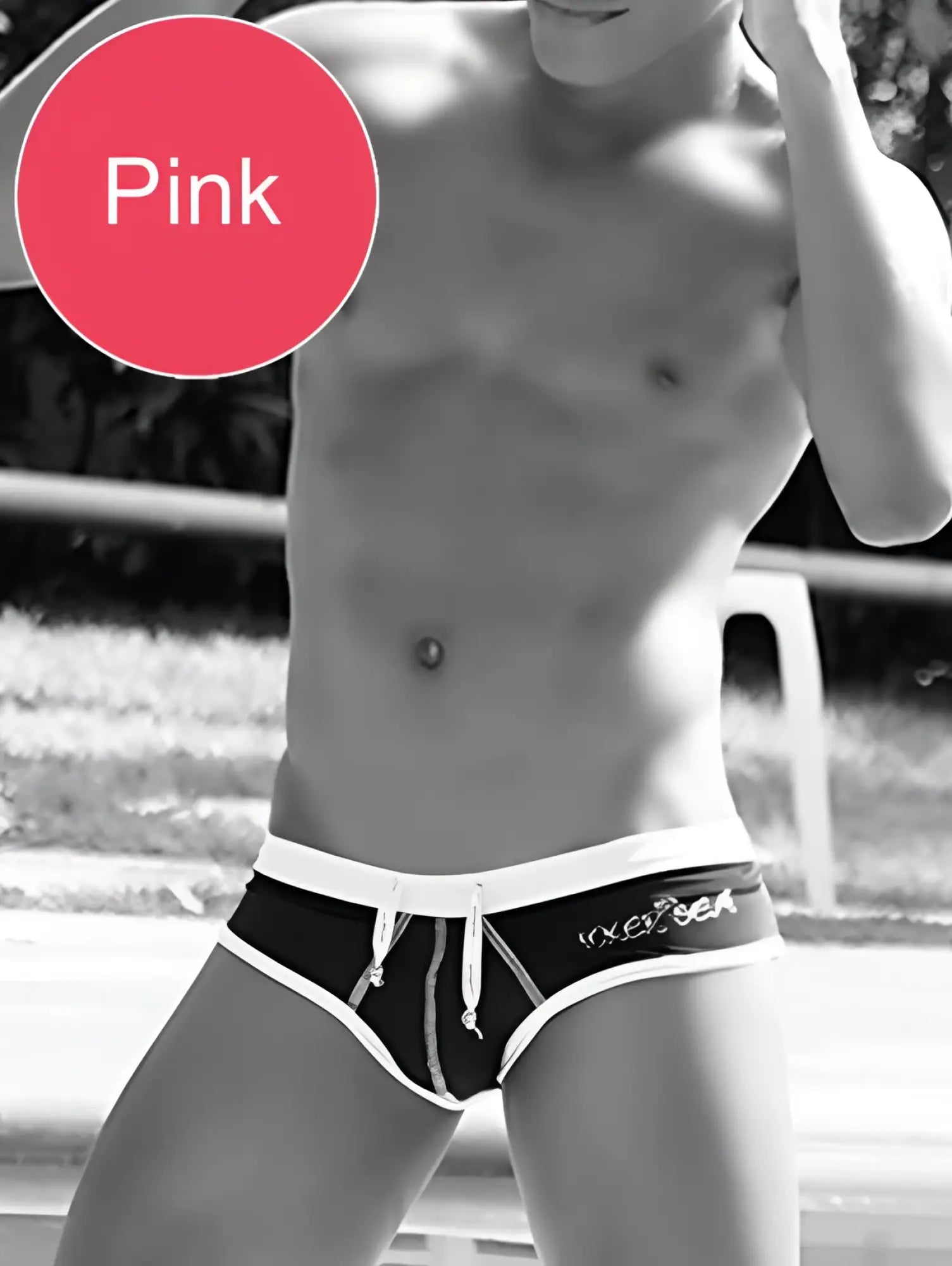 Pink swim trunks with white waistband and drawstring featuring vixen logo from icker sea cheeky mini bikini collection