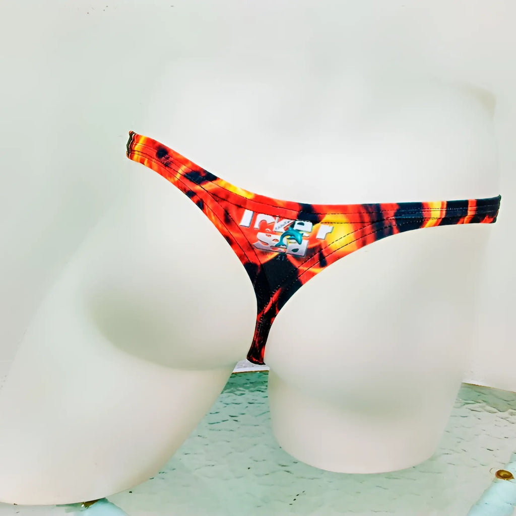 Vibrant orange and black flame-patterned thong underwear with ice logo patch from icker sea fire red collection