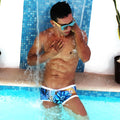 Blue and white floral mesh side square cut swim trunks with bold tropical pattern by icker sea