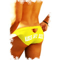 Bright yellow icker sea kiss my ass back cut out slip bikini swimwear with white text and cutout design showing back view