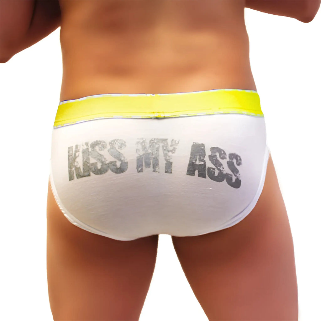 White briefs with bright yellow waistband and kiss my ass text in distressed gray from icker sea mango collection