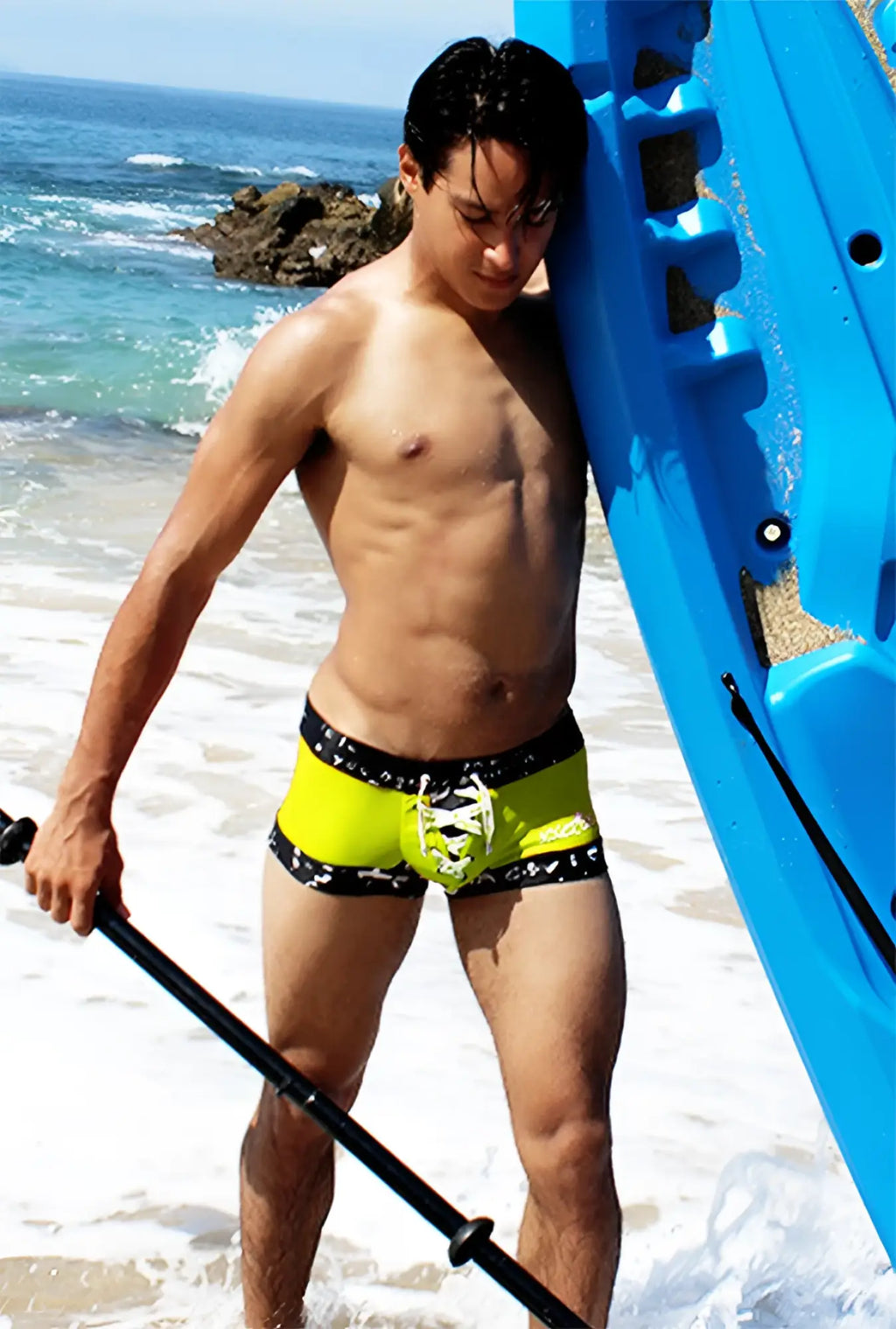 Bright neon yellow icker sea lace up contrast square cut trunk swimwear with black patterned trim for swim use