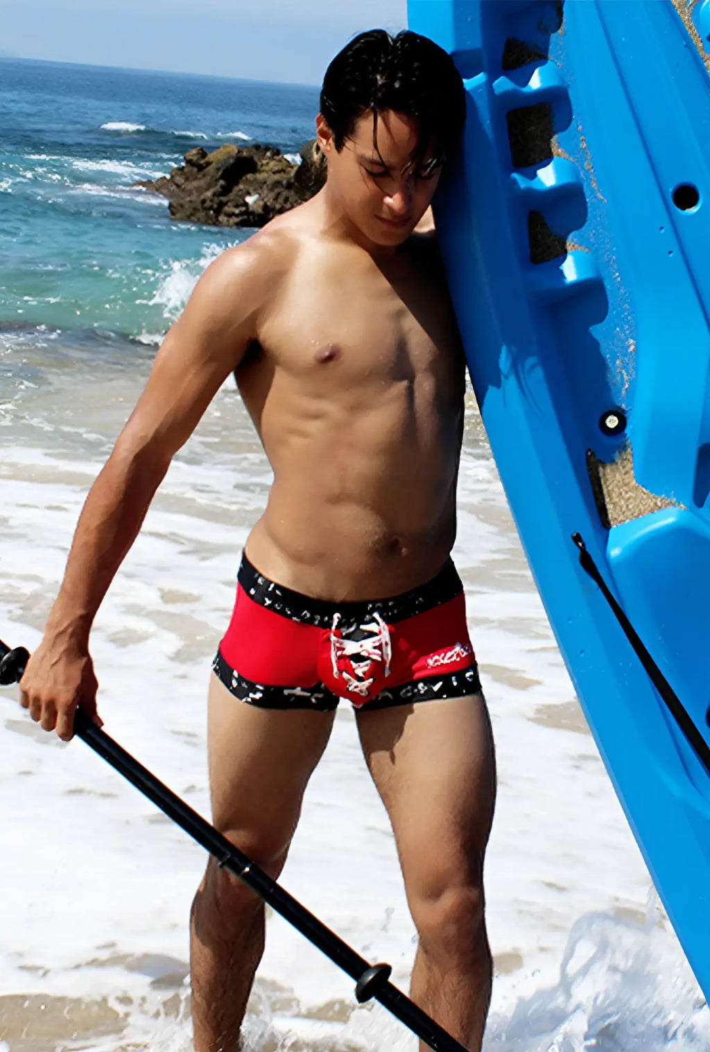 Icker Sea lace up contrast square cut swim trunks in red and black with white skull design on the front