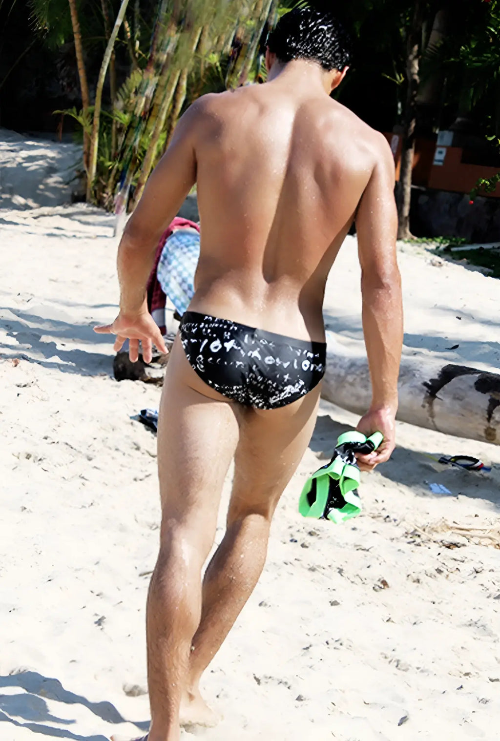 Black icker sea letters bikini swimwear trunks with white graffiti lettering and patterned design for swimming