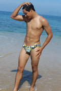 Men’s Icker Sea Letters bikini swimwear trunks with vibrant green yellow and black graphic pattern front view