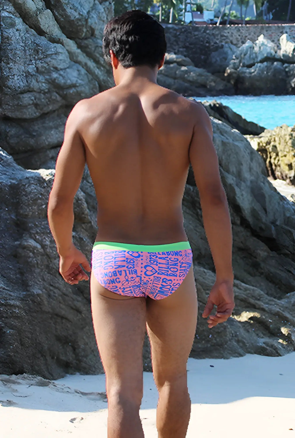 Icker Sea letters bikini swimwear pink and green patterned swim trunks with bright green waistband front view