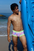 Icker sea letters square cut trunk swimwear with vibrant pink and blue graphic pattern and neon green trim