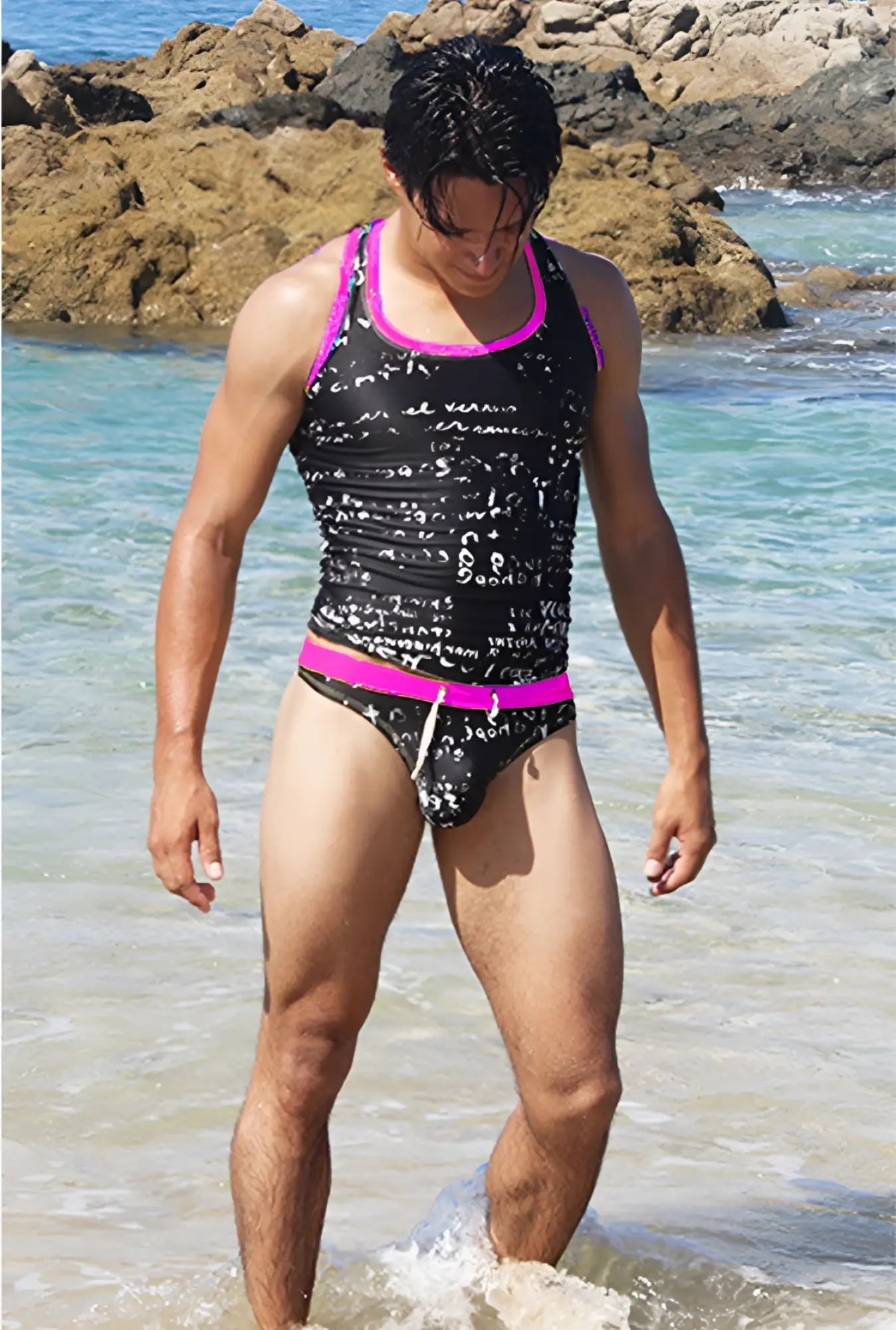 Black and fuchsia icker sea letters tank top t shirt with bright pink and black swim trunks featuring math equation print