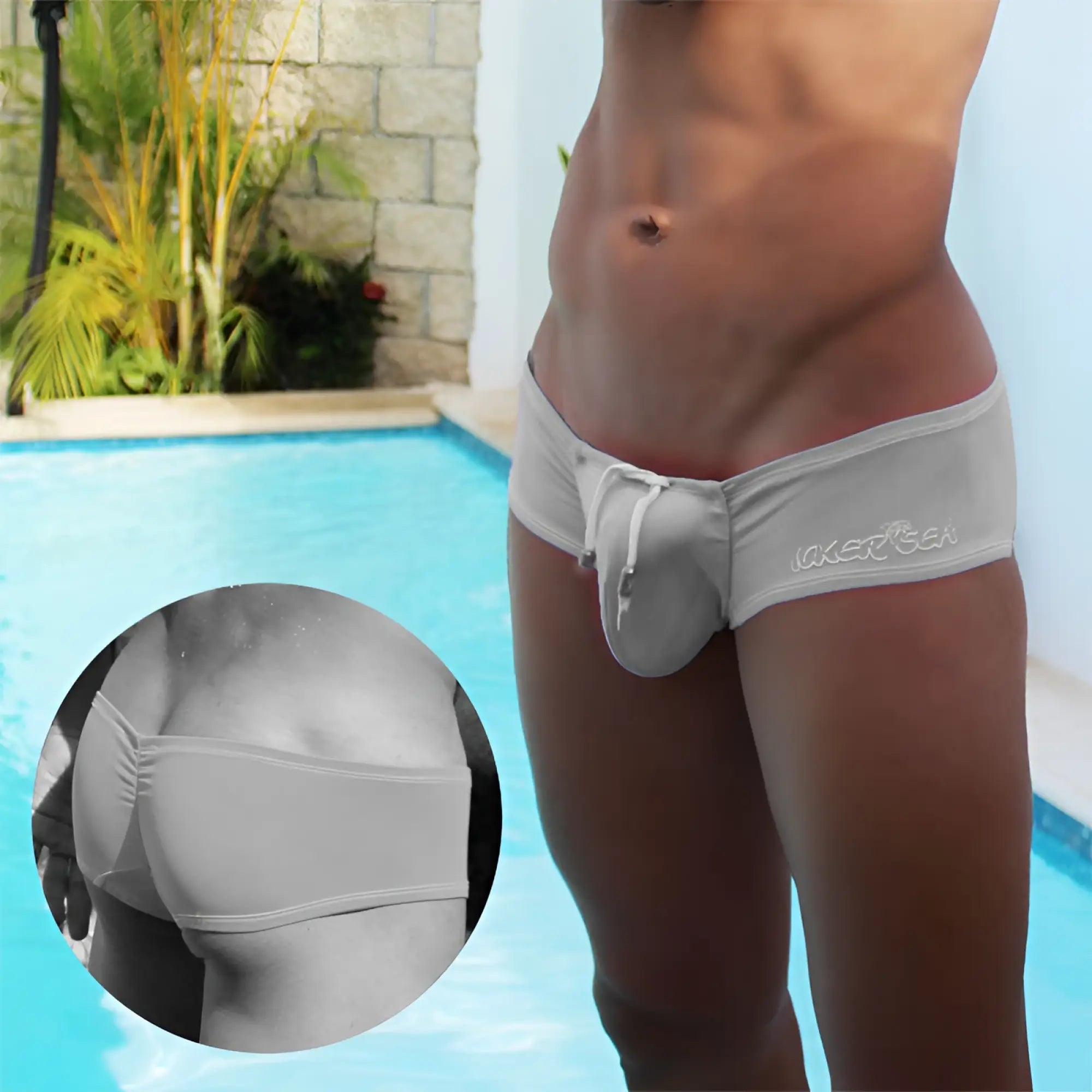 Light gray stretchy fabric laker sea low rise scrunched back cheeky mini square cut swim trunks with drawstring waistband