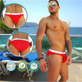Red men’s swim trunks with white elastic waistband featuring kensington branding in icker sea sailor style