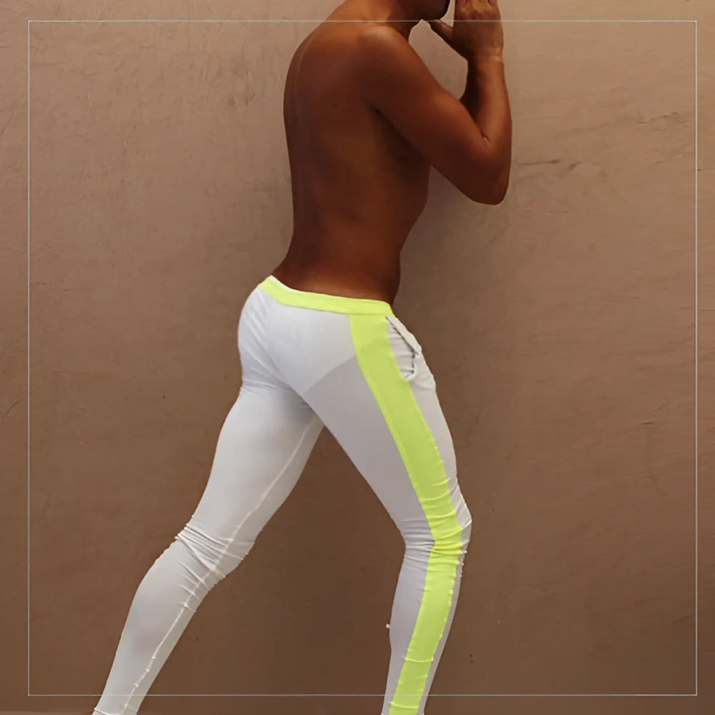 White Icker Sea side stripe runner pants with vibrant neon yellow green side stripe and matching waistband