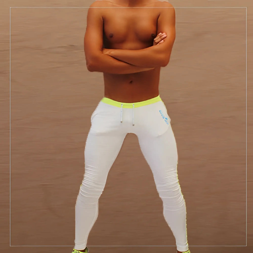 White icker sea side stripe runner pants with neon yellow waistband and subtle blue thigh logo for athletic wear