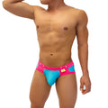 Bright pink and turquoise icker sea smile me duotone brief underwear with bold colorful swim trunk design