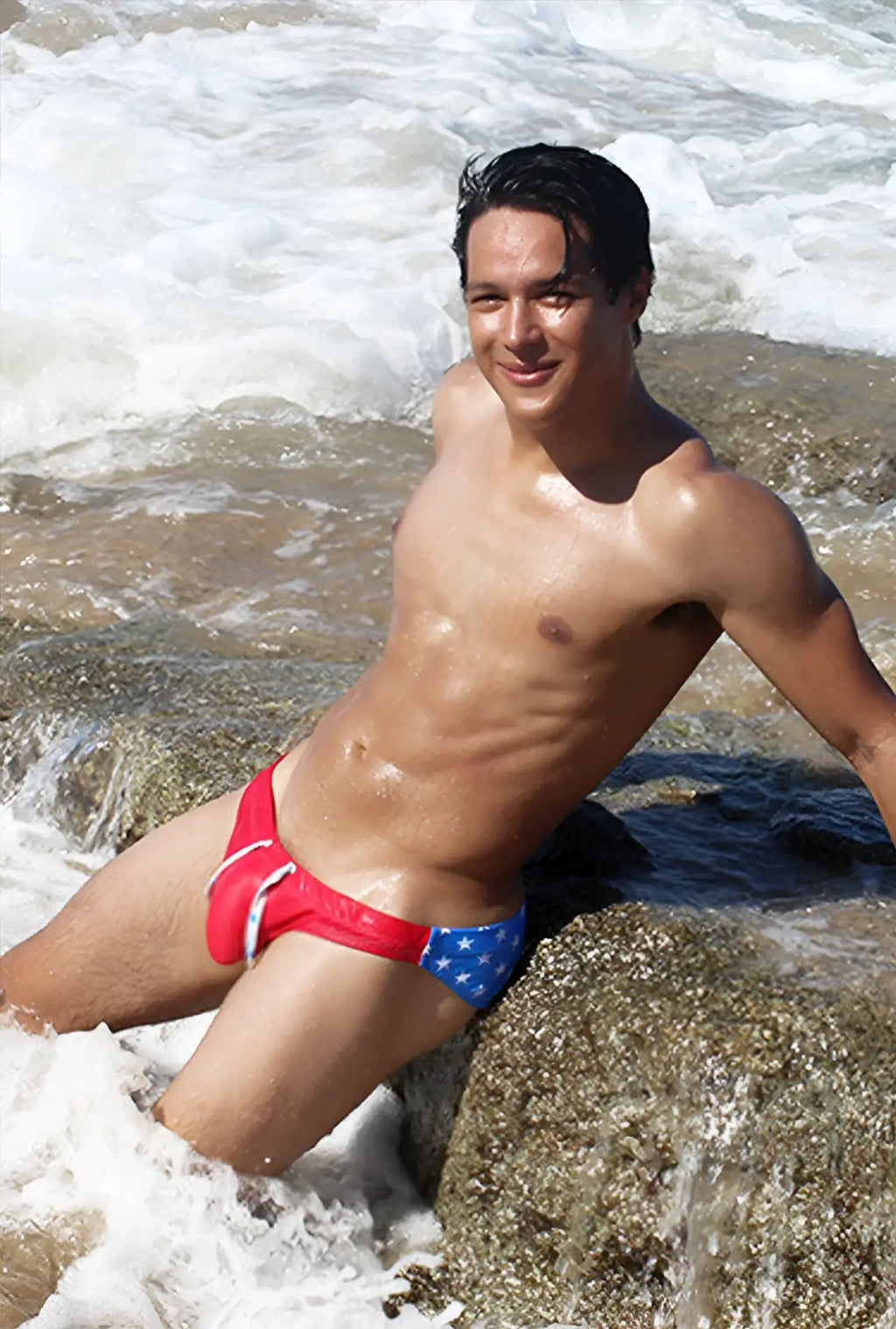 Red and blue icker sea stars bikini swimwear with white stars and bold american flag design on swim trunks side