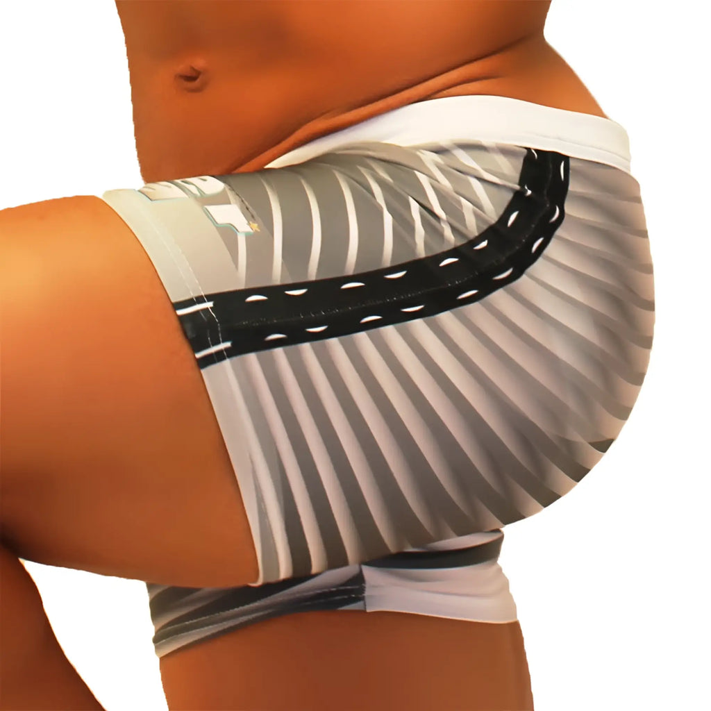 Icker Sea steel lines square cut trunk swimwear in grey with white and black striped athletic shorts worn by a person