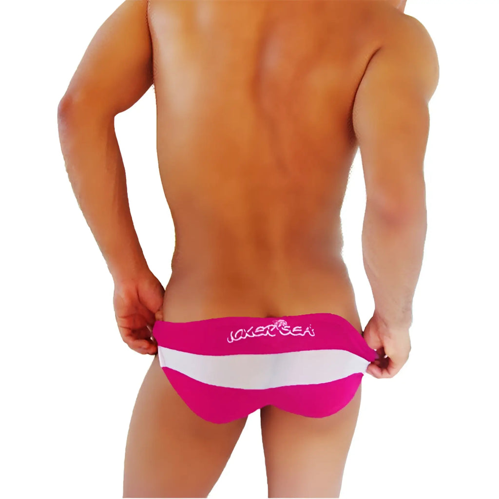 Bright pink and white striped men swim trunks with joker and sea branding from Icker Sea transparent panel slip bikini underwear fuchsia COI-16-23