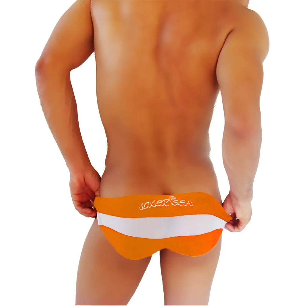 Orange and white striped men’s swim trunks with joker sea embroidered on the waistband for beachwear
