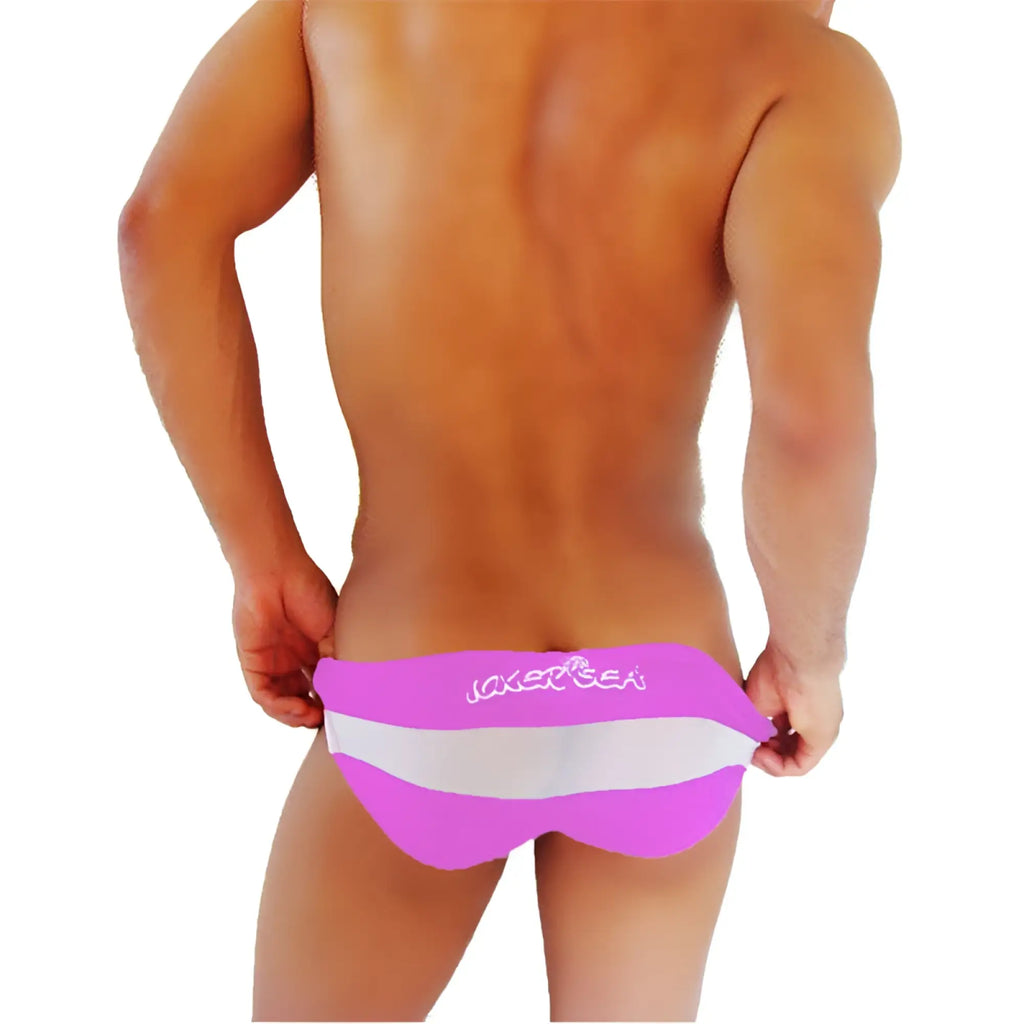Bright pink and white striped men’s swim trunks with jaker sea logo from icker sea transparent panel slip bikini underwear