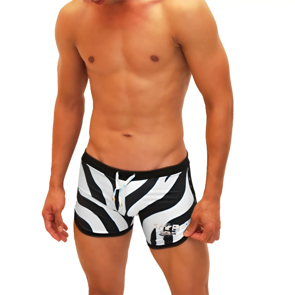 Icker Sea zebra open side suspender scalloped swim shorts in black and white zebra stripes with black waistband and blue drawstring