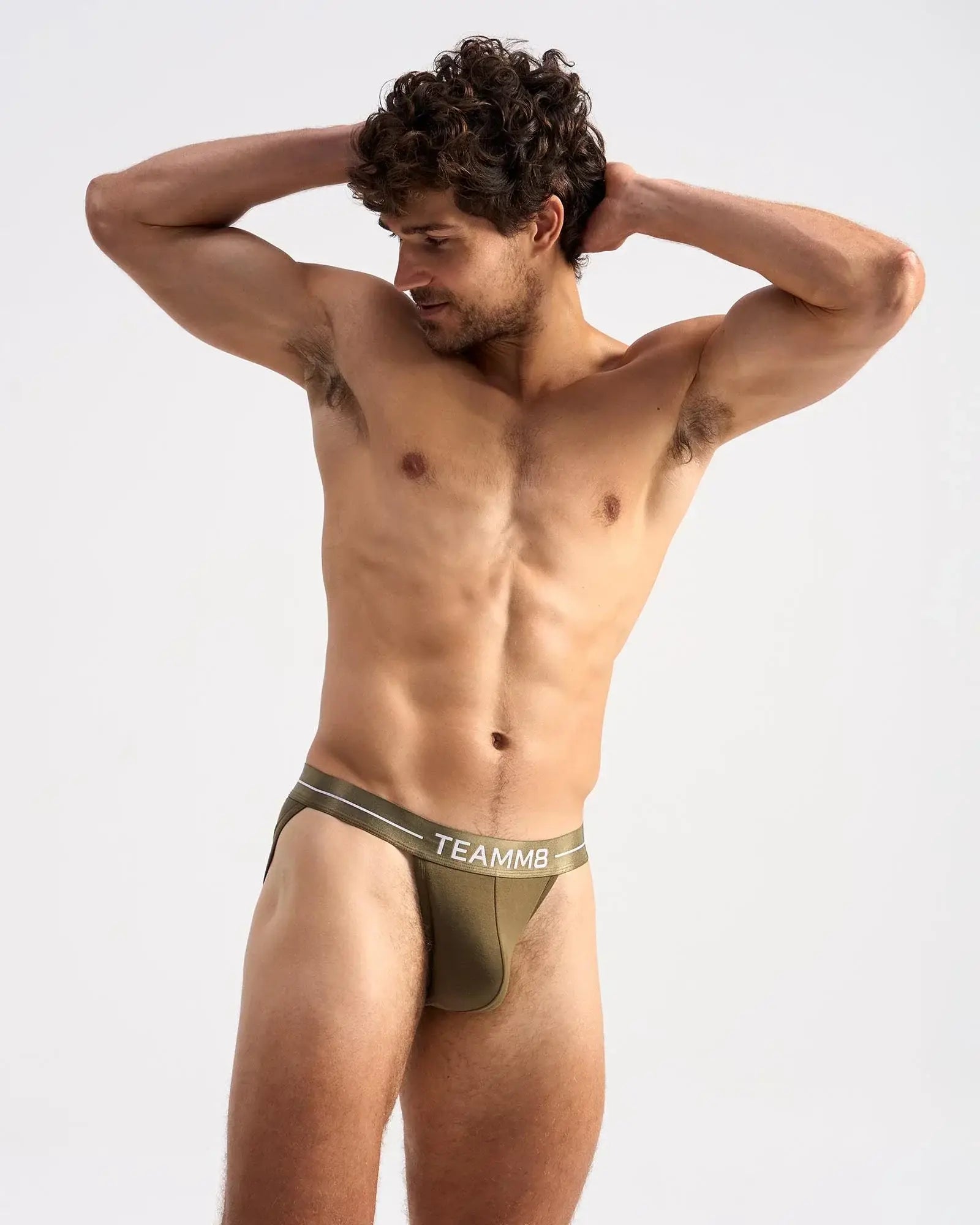 Olive green ICON SPORTS BRIEF with white logo waistband and subtle side stripes designed for athletic support