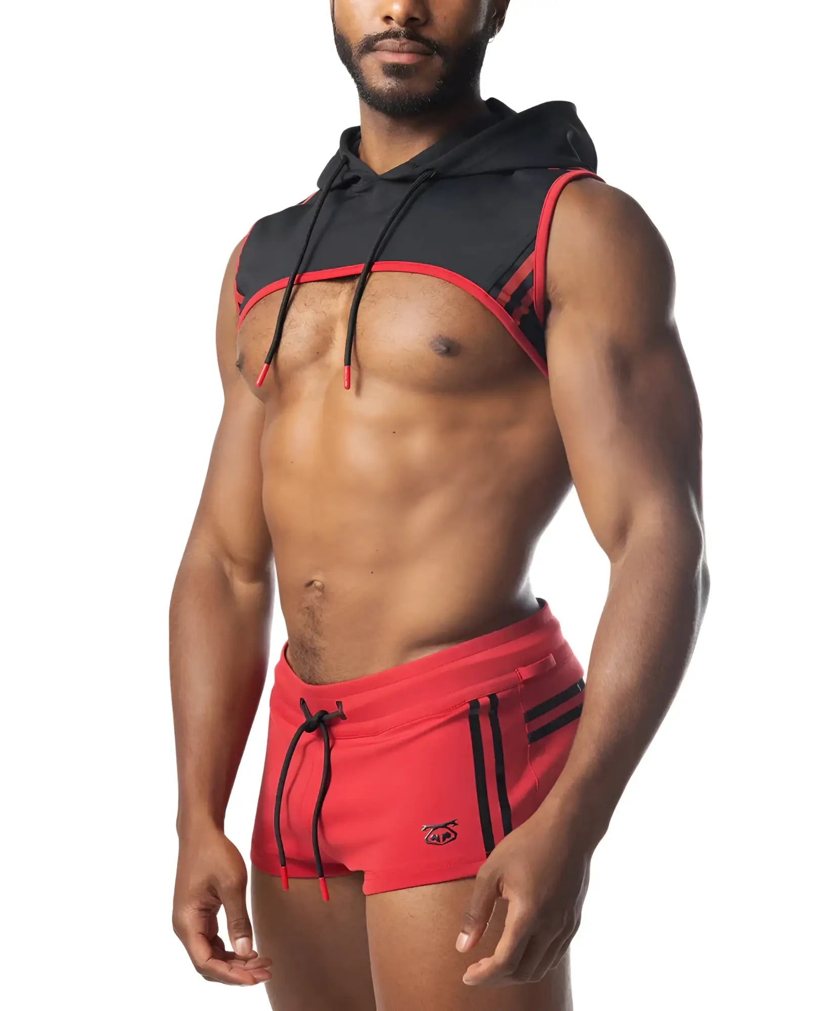 Black and red sleeveless ignite cropped hoodie with drawstring hood worn over a muscular torso in cotton blend