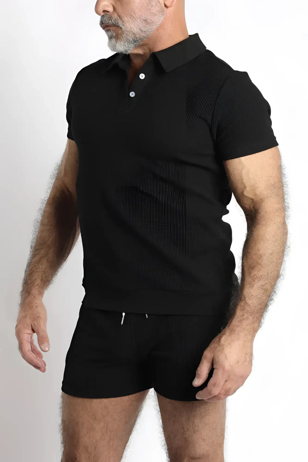 Black indio knit short sleeve polo shirt with classic collar and white buttons made from soft knit fabric