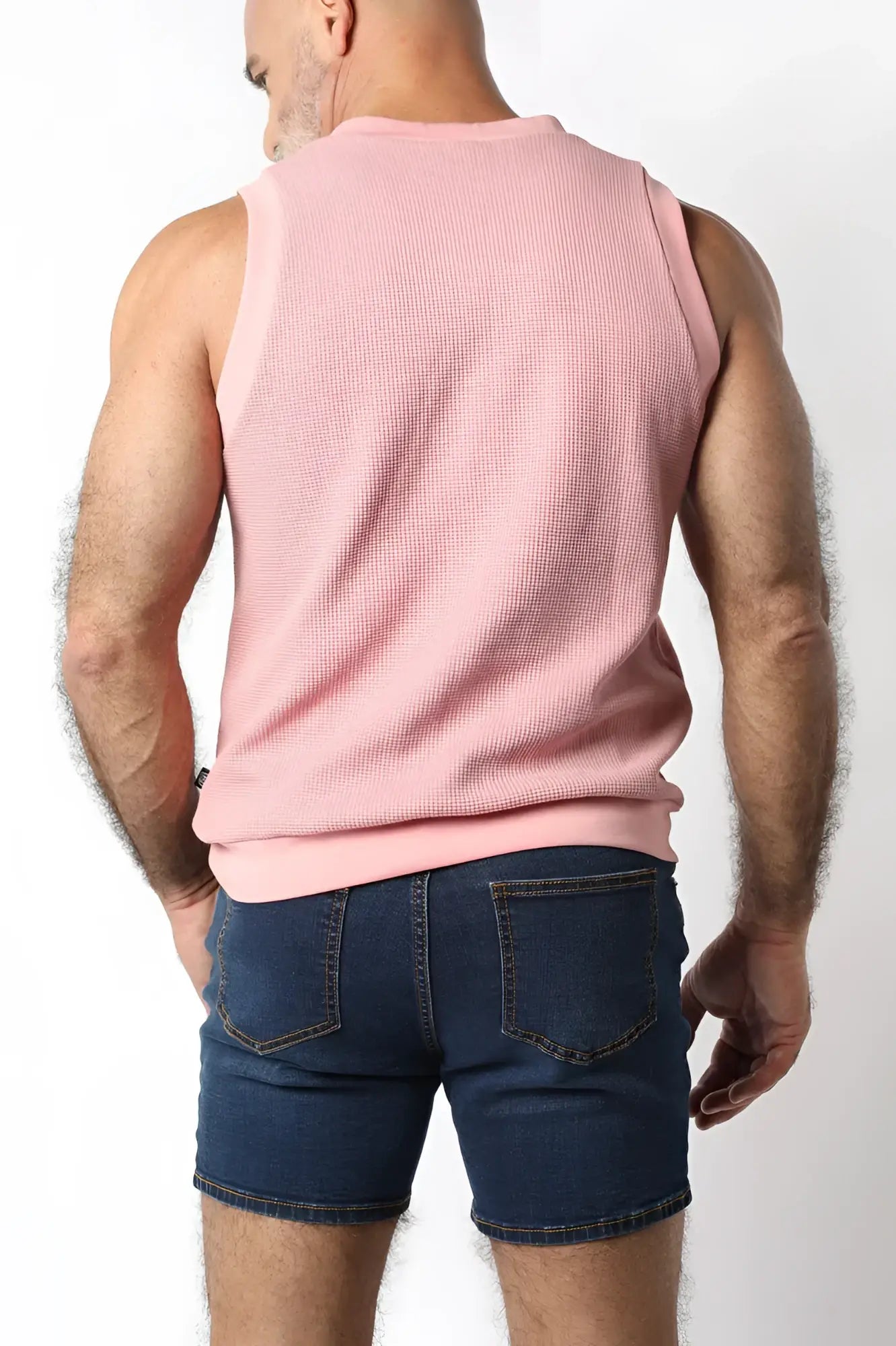 Indio knit tank top is a pink waffle knit sleeveless top with a ribbed hem perfect for warm weather