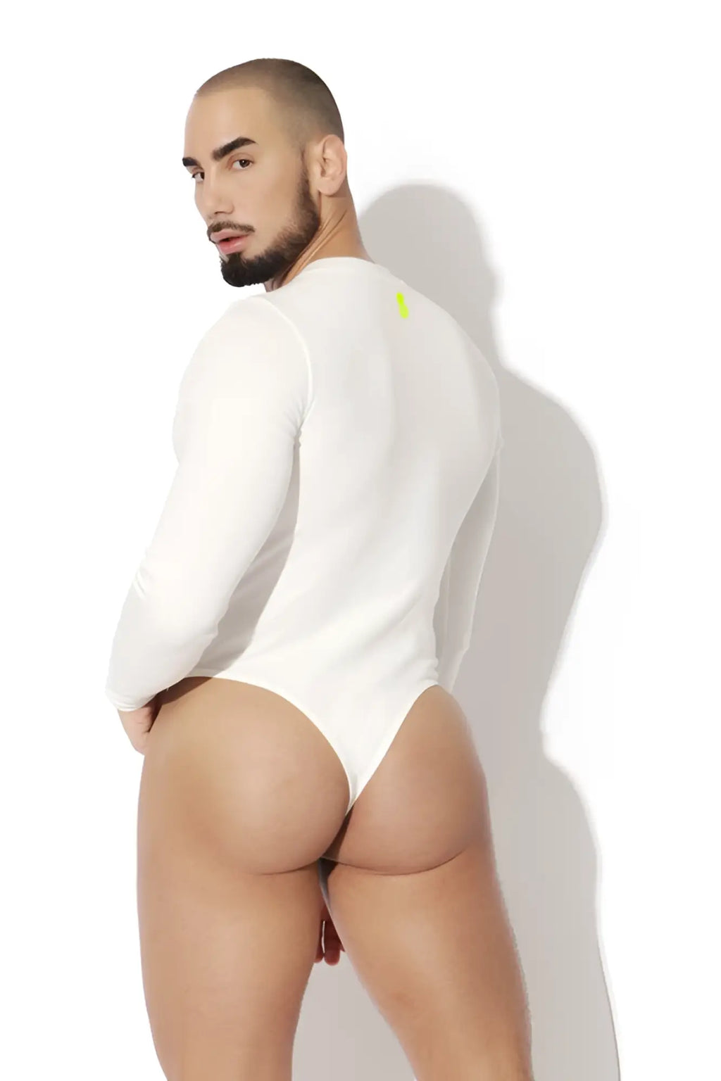 Back view of infinity long sleeve button up white bodysuit with small neon yellow logo on upper back