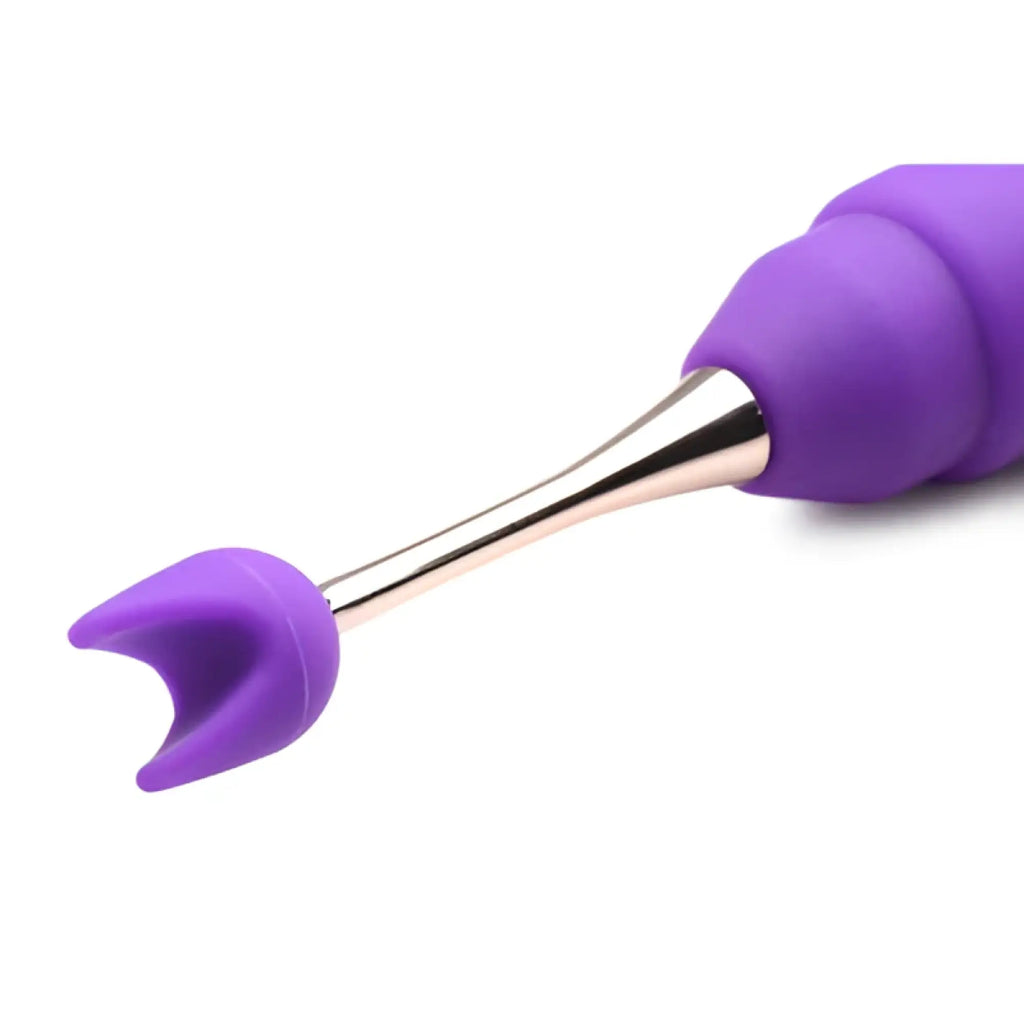 Inmi 10X En Pointe silicone teaser with a purple curved attachment on a metallic stem against a white background.