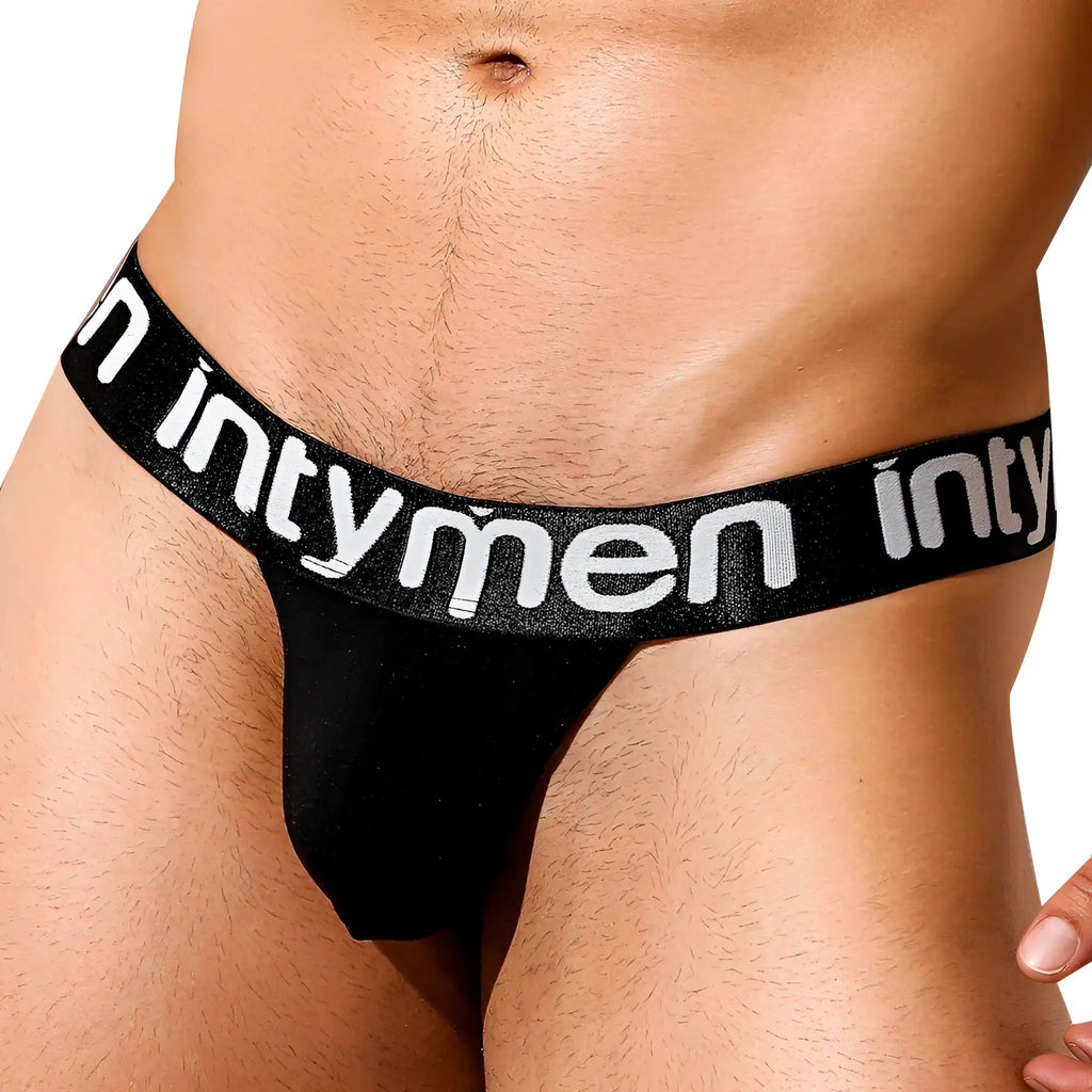 Black intymen ine025 jockstrap thong with wide white lettered waistband shown from the back side