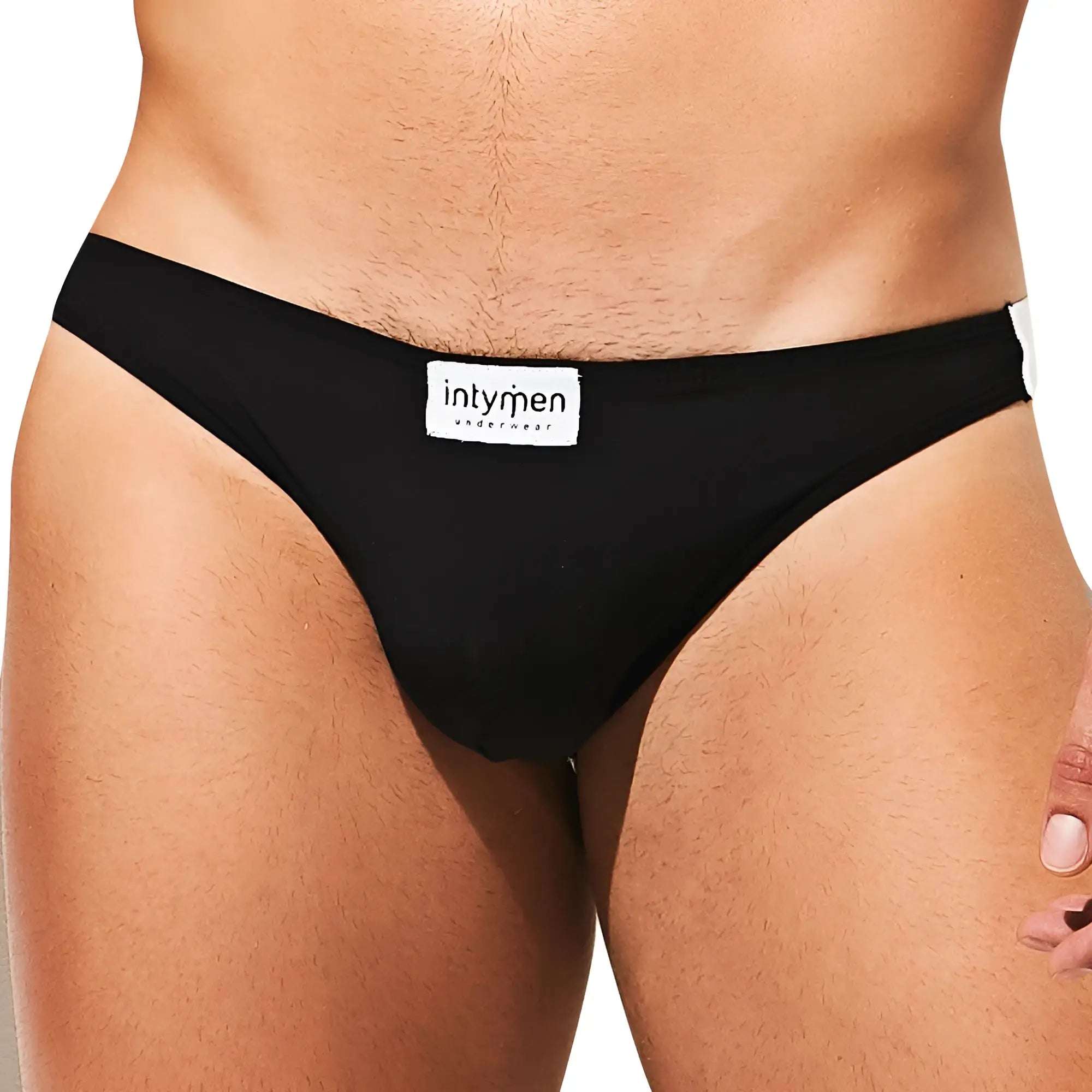 Intymen INE027 jockstrap in black with white label and trim designed for comfortable support and style