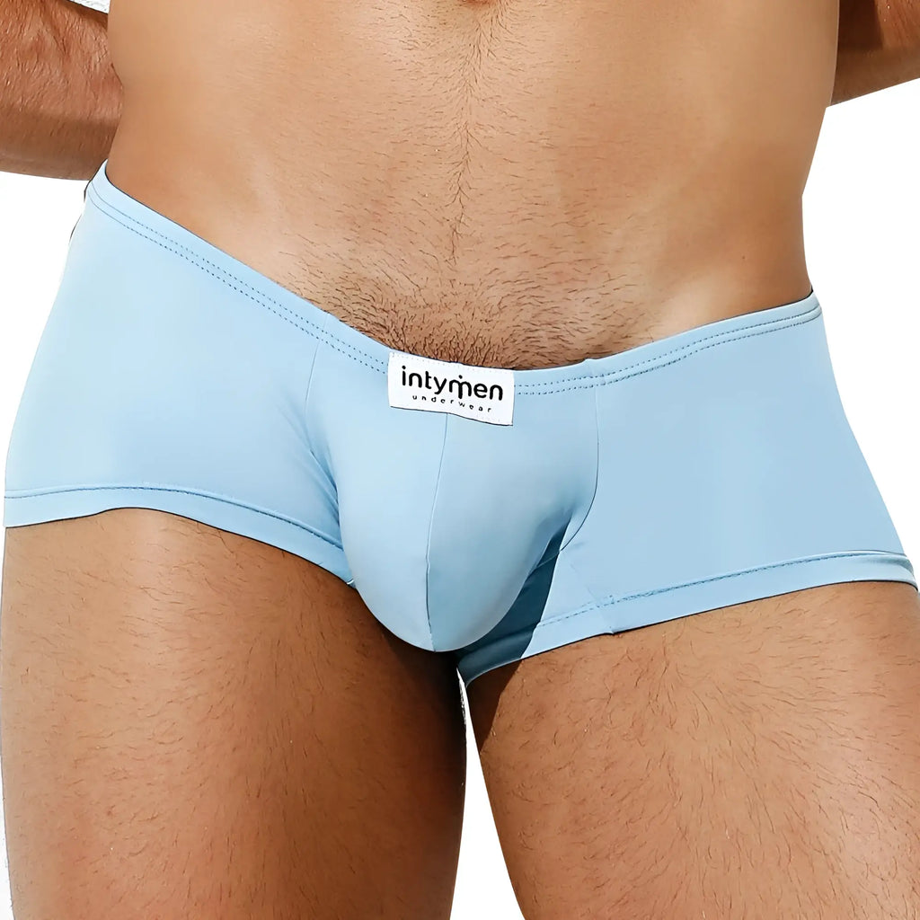 Light blue form-fitting men’s briefs with a white intymen underwear label on the waistband from Intymen ING071 boxer trunk