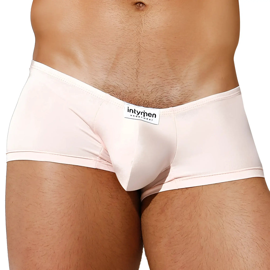 A sleek pale pink intymen ing071 boxer trunk made of smooth fabric with a branded waistband label