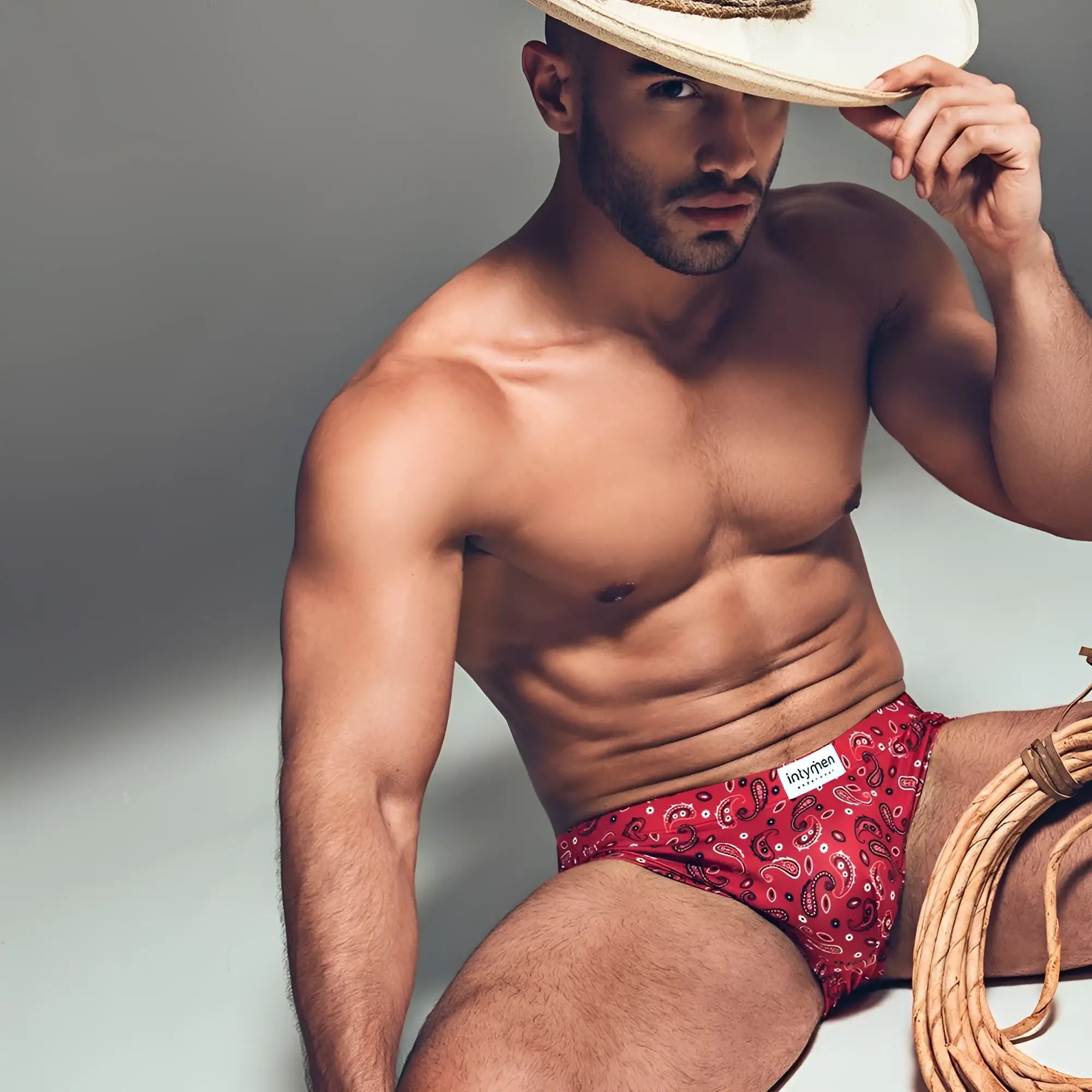 Intymen ini027 bikini brief in red paisley pattern with white branded intyren label on waistband