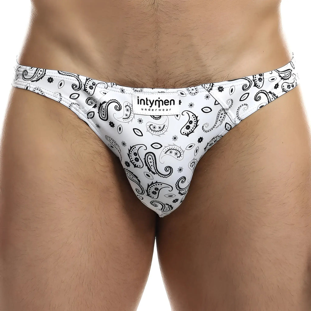 White men’s briefs with black paisley and floral patterns featuring intymen underwear label ini027 bikini brief