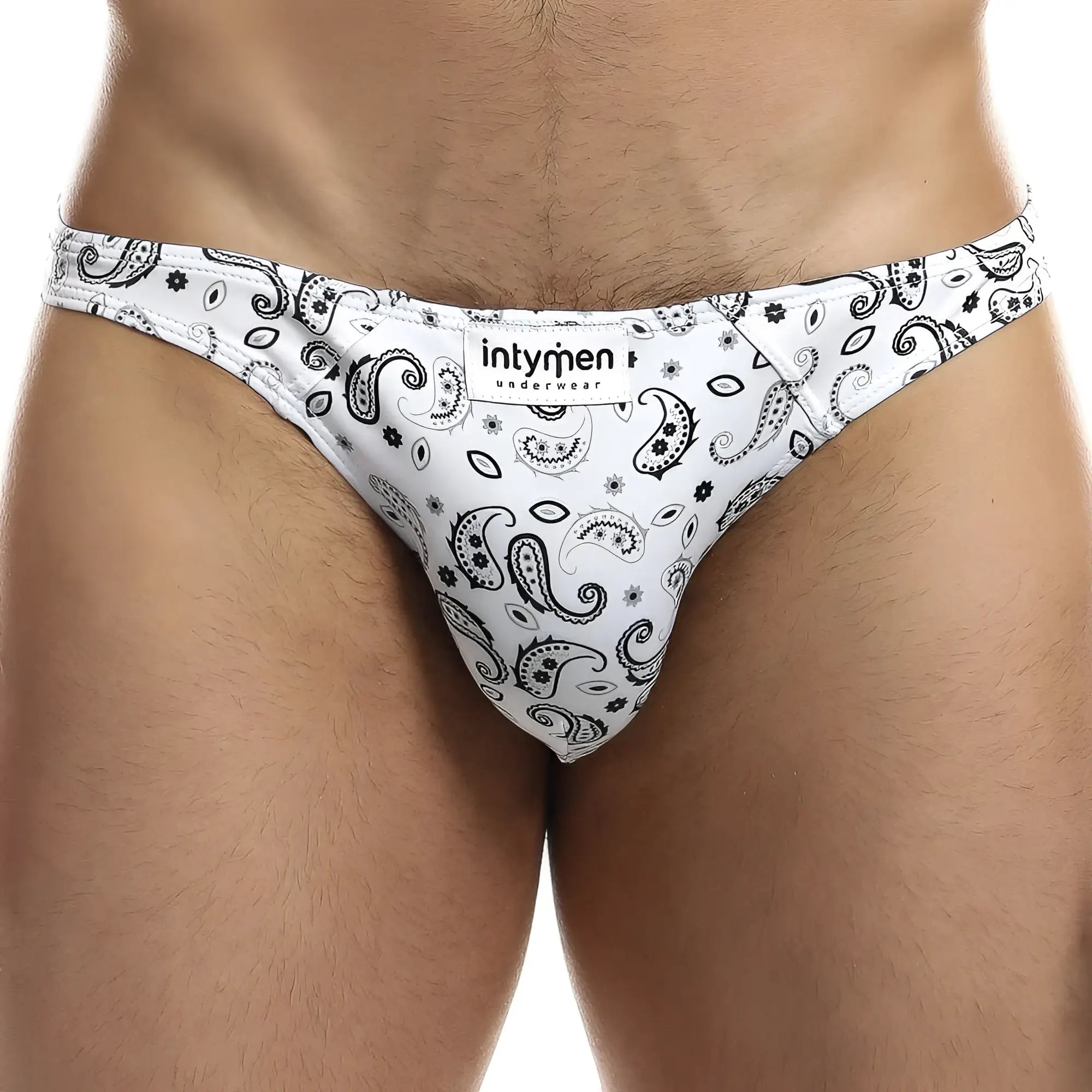 White men’s briefs with black paisley and floral patterns featuring intymen underwear label ini027 bikini brief