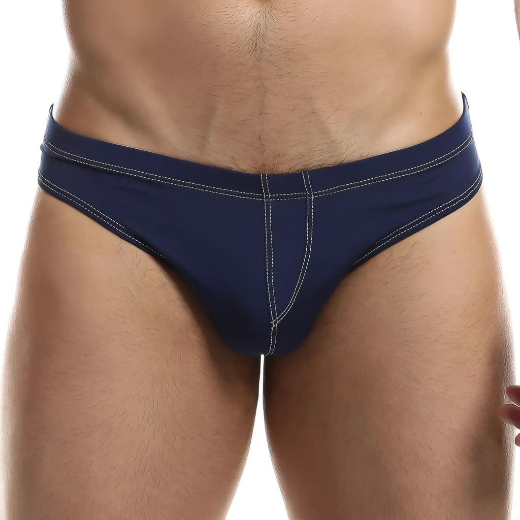 Navy blue intymen ini028 bikini brief swim trunks with white stitching along waistband and leg seams front view