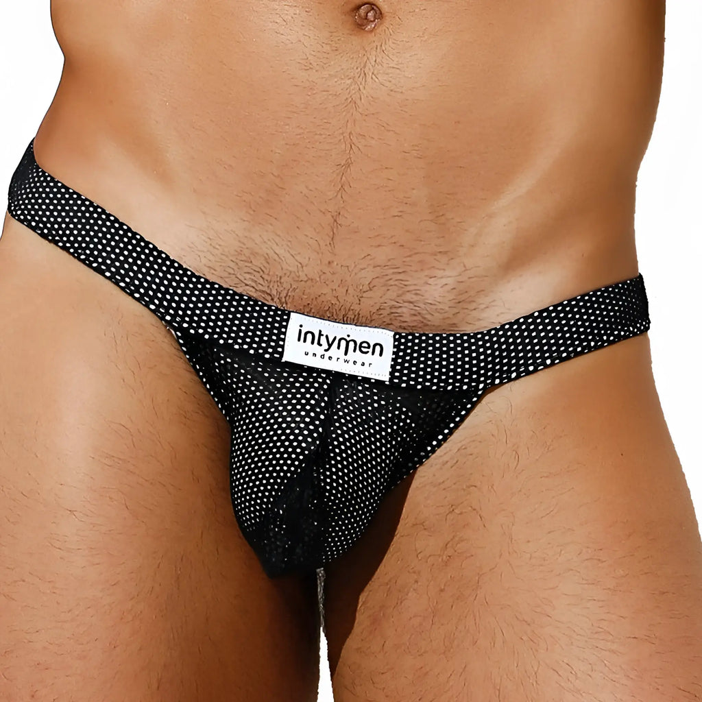 Black mesh thong bikini brief with white polka dots and Intymen branded label in front view