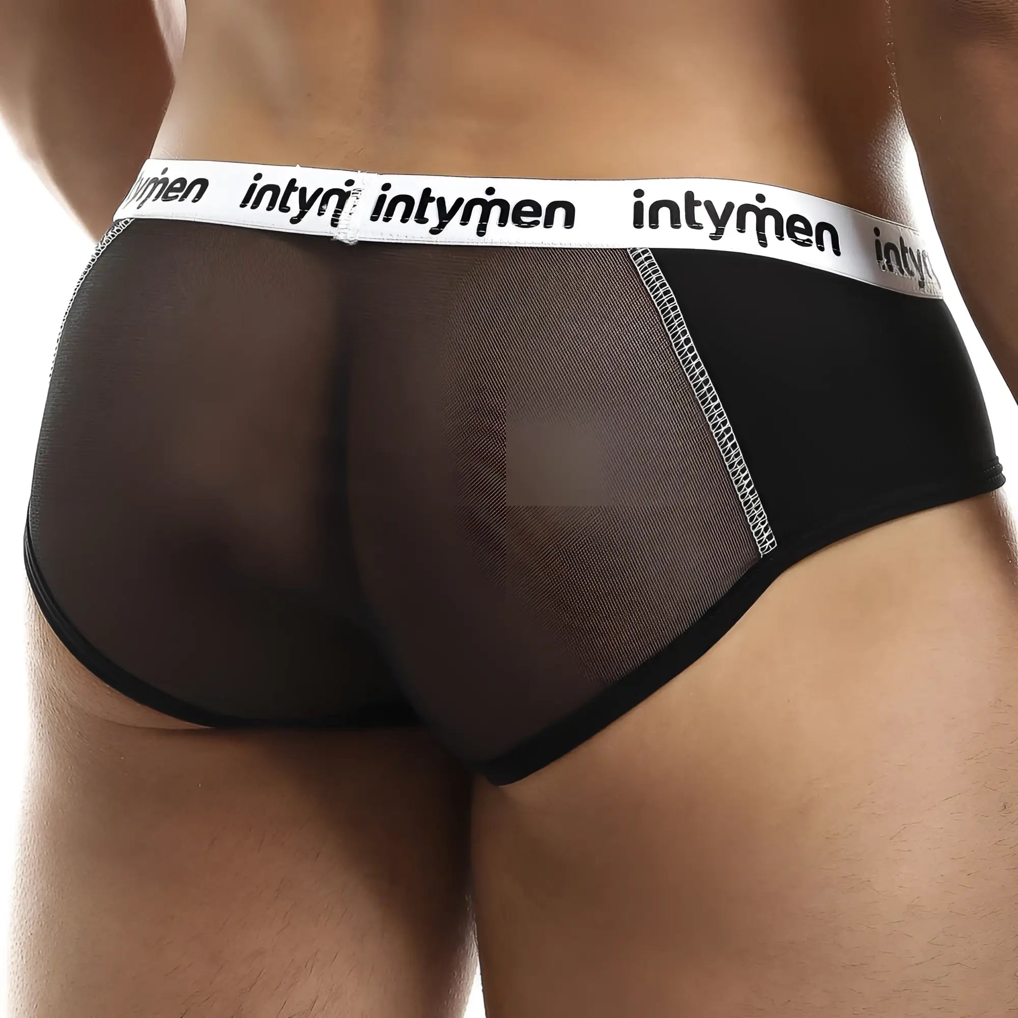 Black mesh briefs with white elastic waistband featuring intymen brand name in black lettering for men