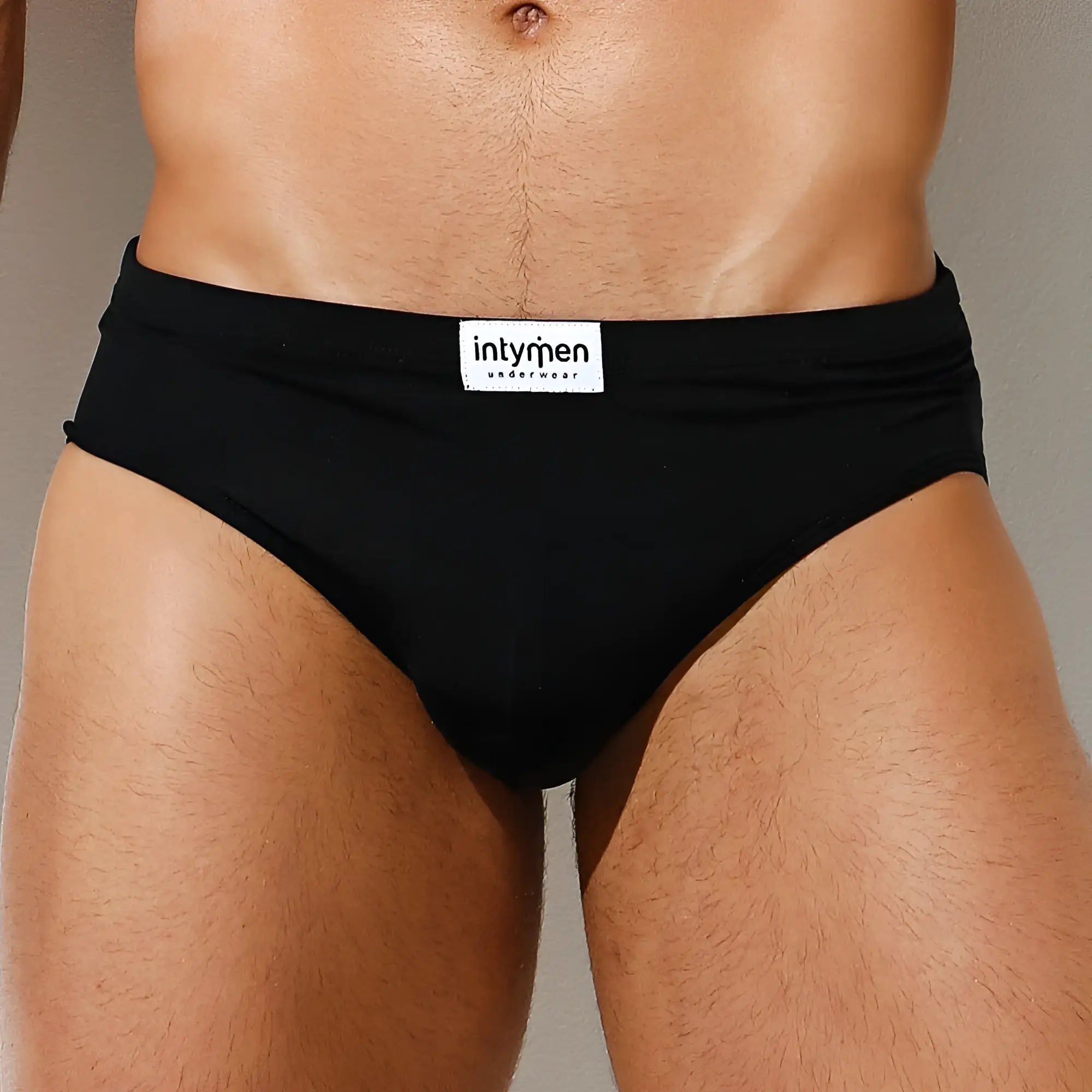 Black Intymen INJ065 brief underwear with white label on waistband designed for comfortable daily wear
