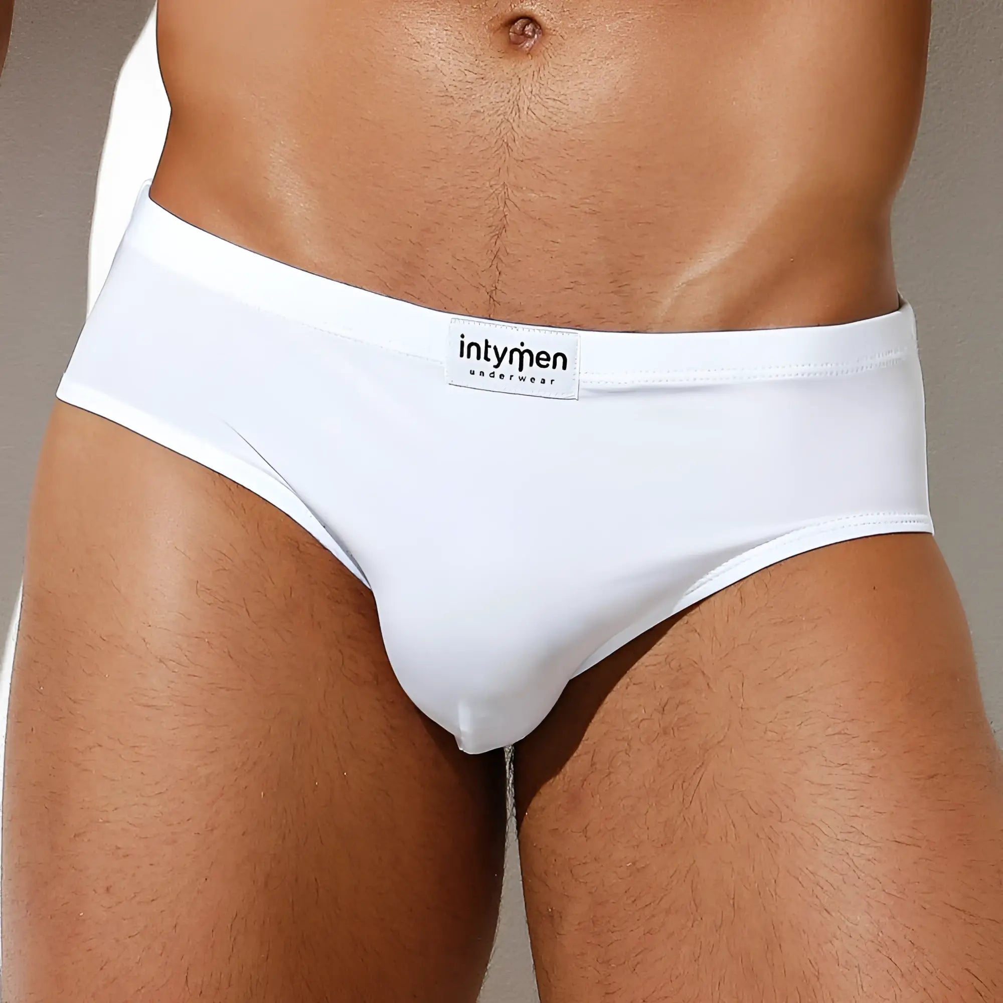 White men’s Intymen INJ065 brief with smooth, form-fitting fabric and branded waistband label visible