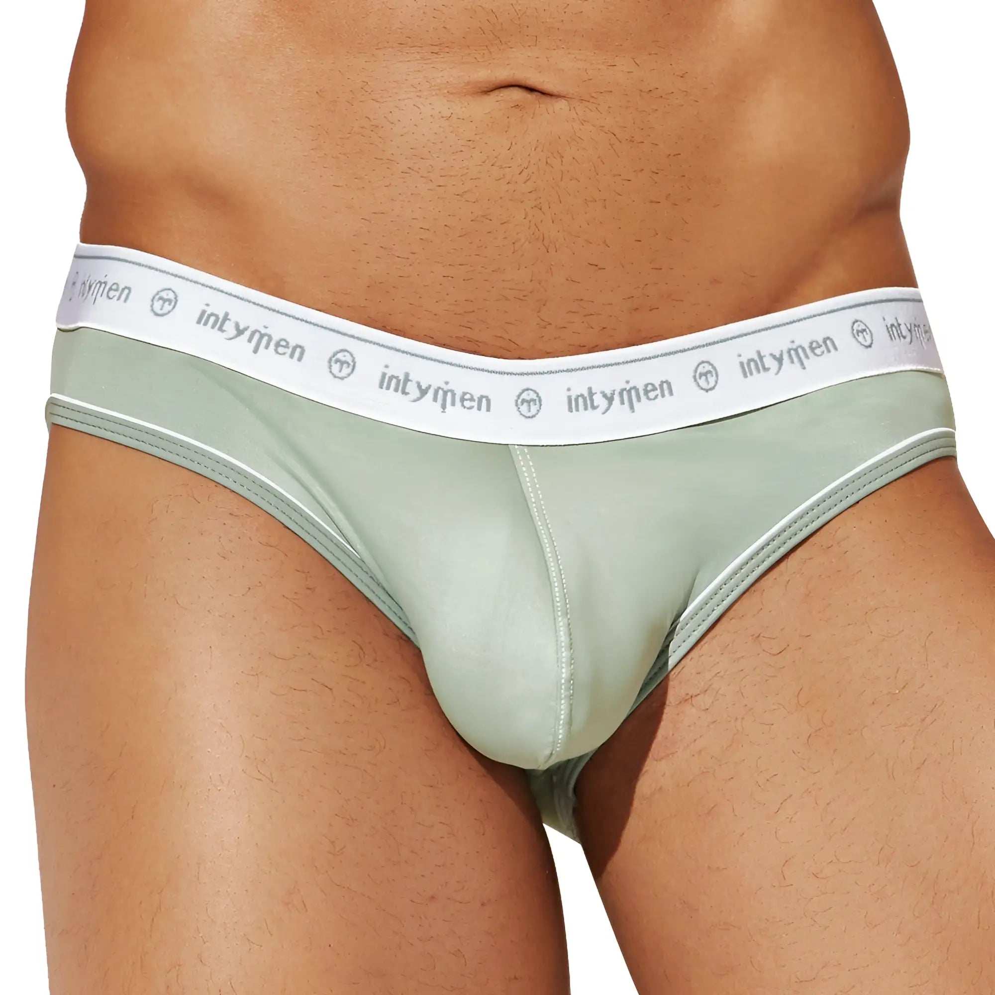 Mint green intymen inj086 brief with white elastic waistband featuring intyrien brand name and logo repeated