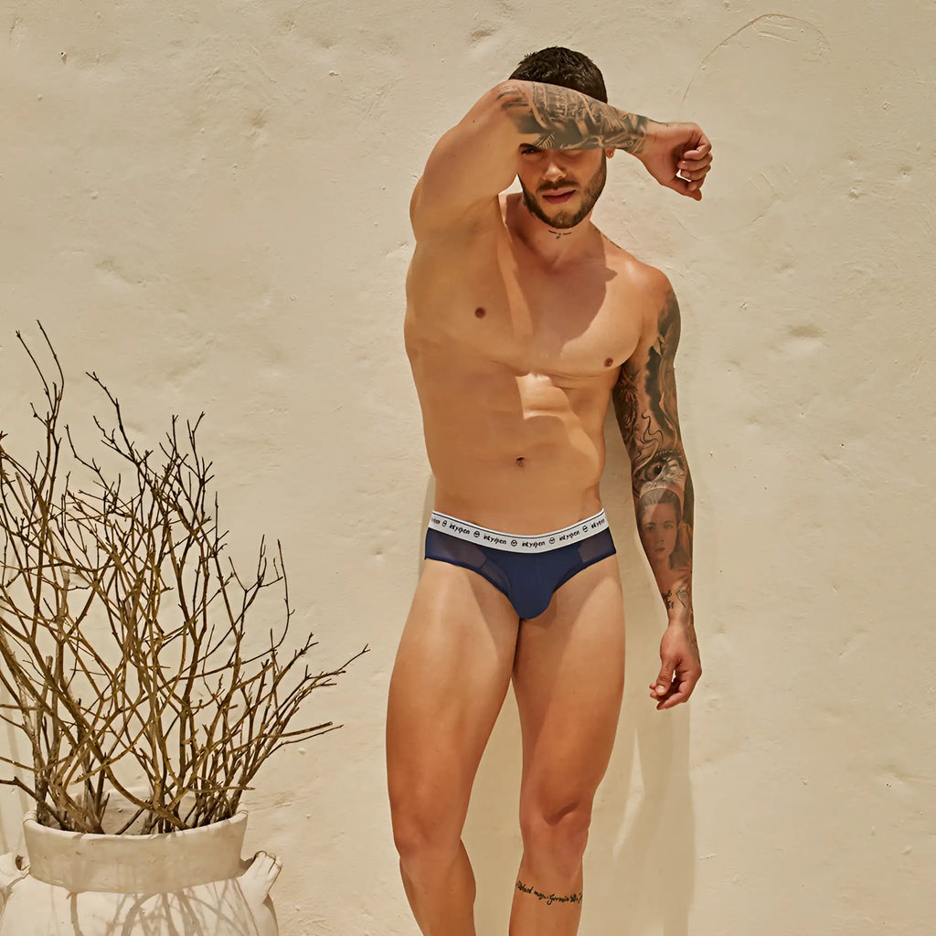 Navy blue Intymen INJ087 brief featuring a white elastic waistband with repeating meyven logos