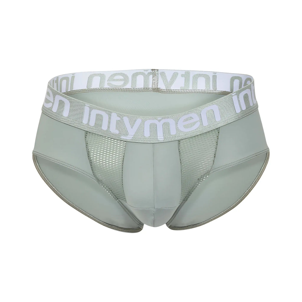 Light green Intymen INJ103 briefs with white elastic waistband, gray logo, and mesh side panels for breathability