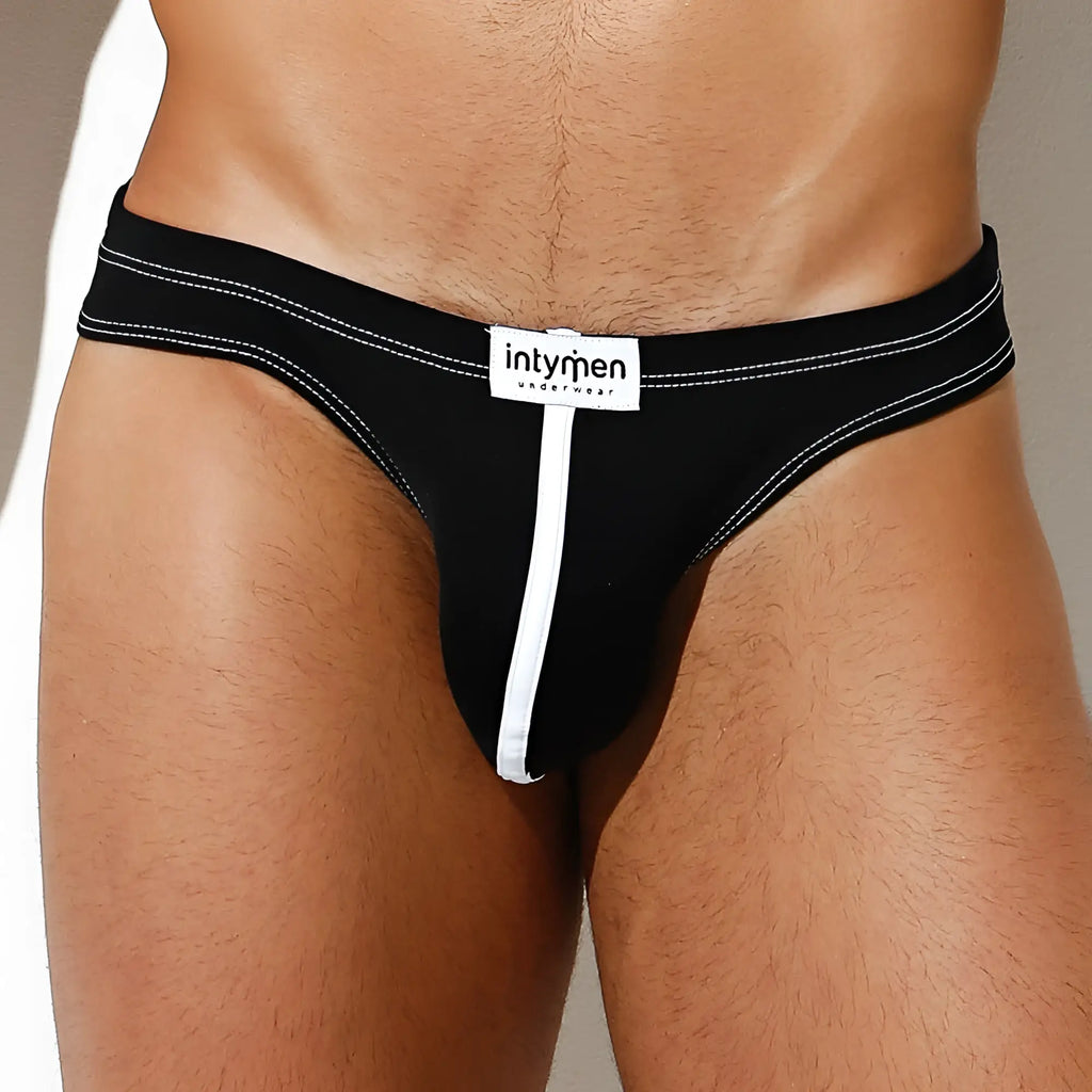 Black intymen ink011 thong underwear with white stitching and central zipper for a bold and stylish look
