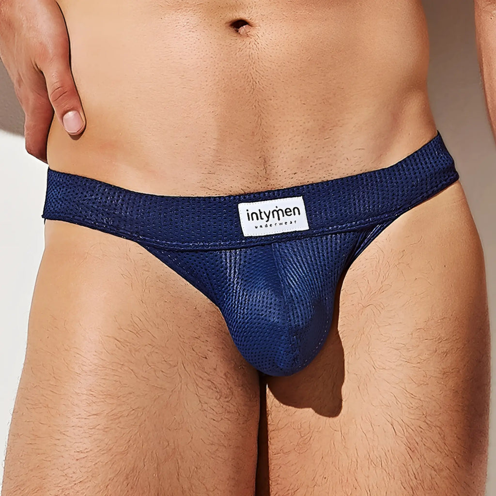 Deep blue mesh briefs with a white intymen brand label on the waistband from intymen ink014 thong collection