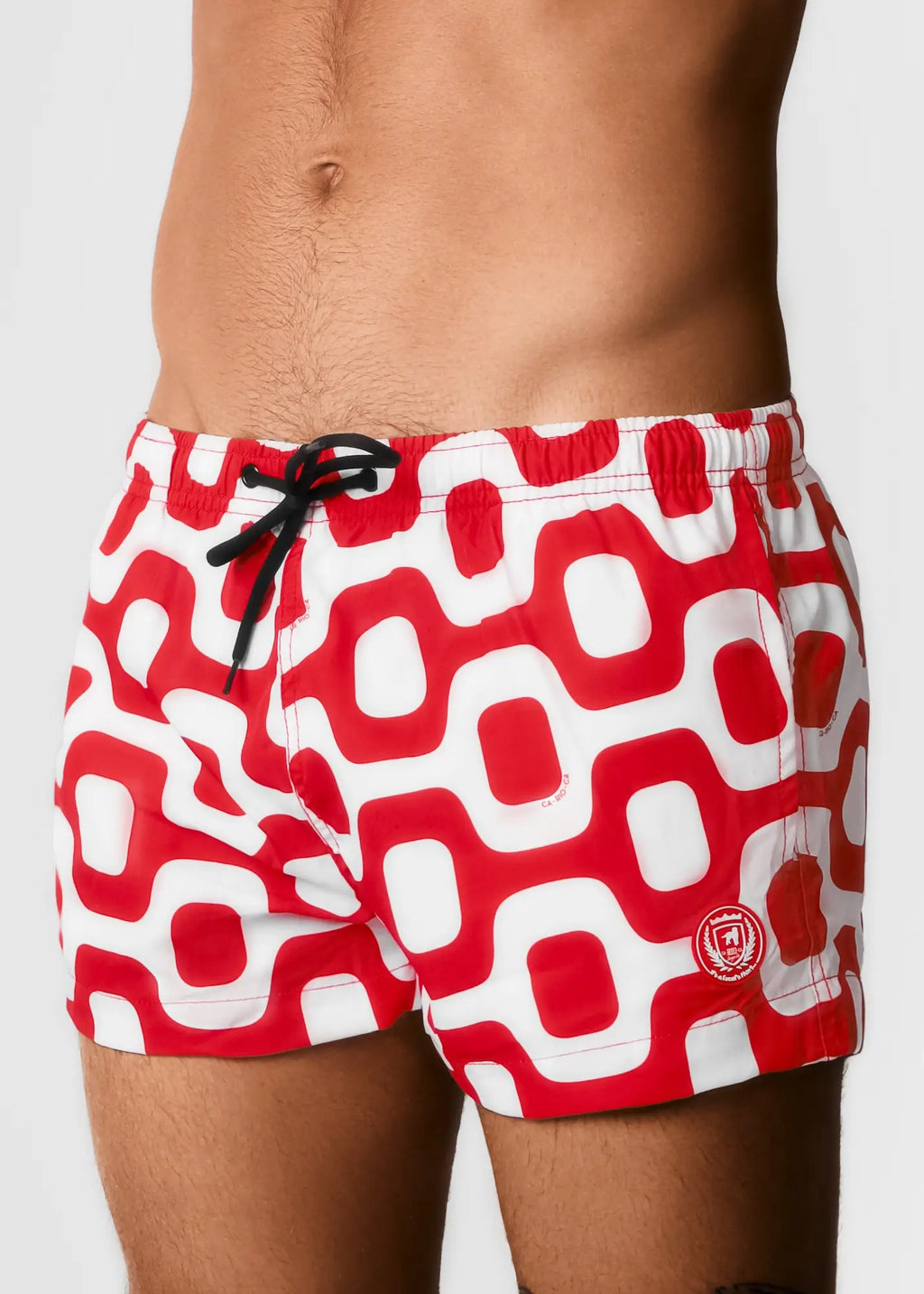 Red and white geometric patterned Ipanema pavement swim trunks with black drawstring for casual beachwear