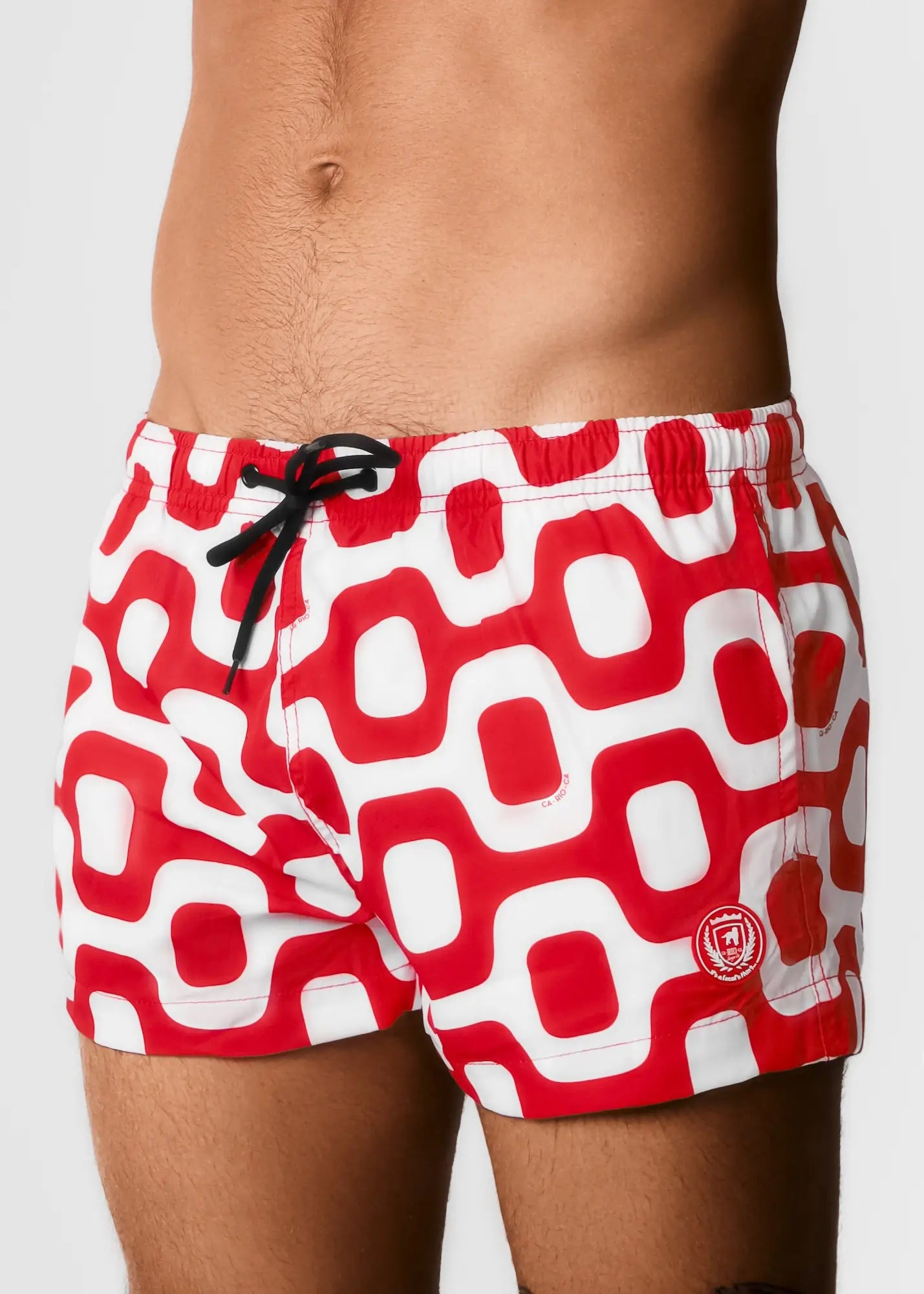 Red and white geometric patterned Ipanema pavement swim trunks with black drawstring for casual beachwear