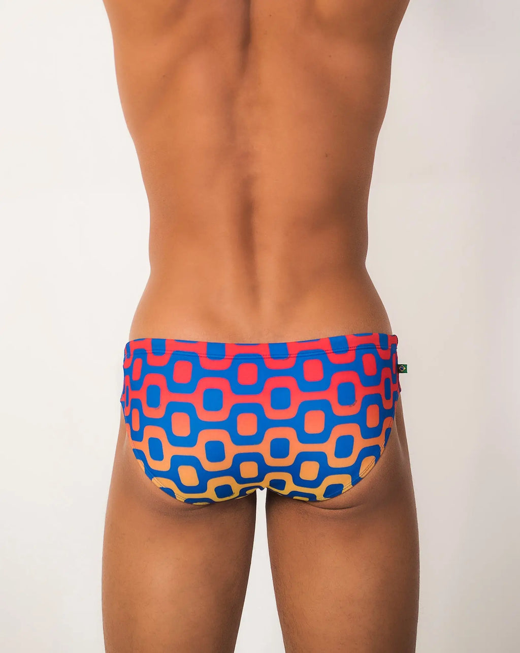Ipanema sunga men’s designer swimwear vibrant blue and coral geometric-patterned retro swim trunks