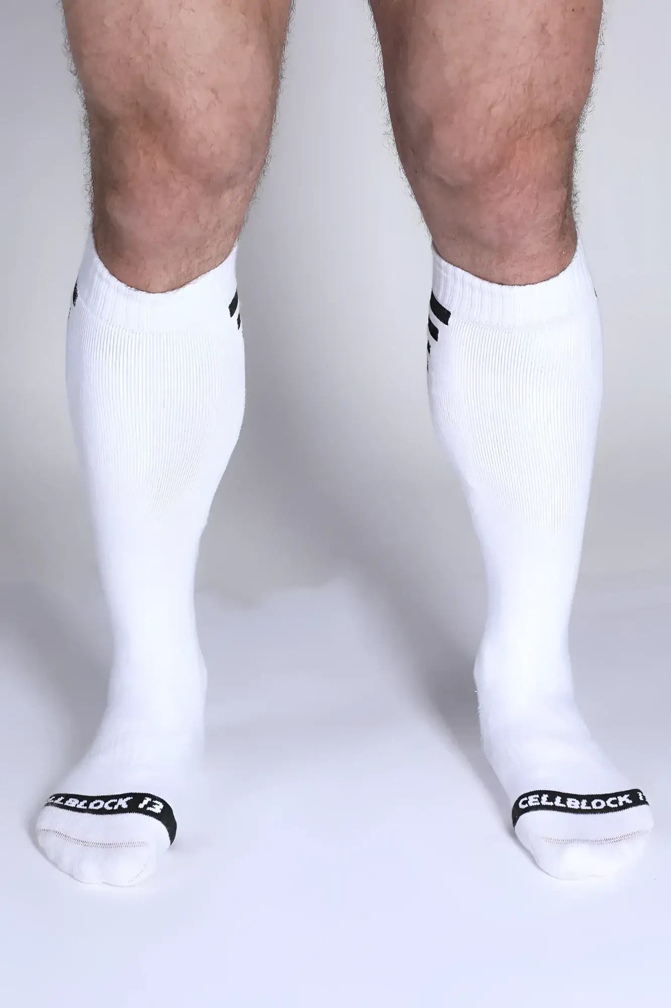Iron grip knee high sock in white with black cuff stripes and cellblock 13 branding on the toe